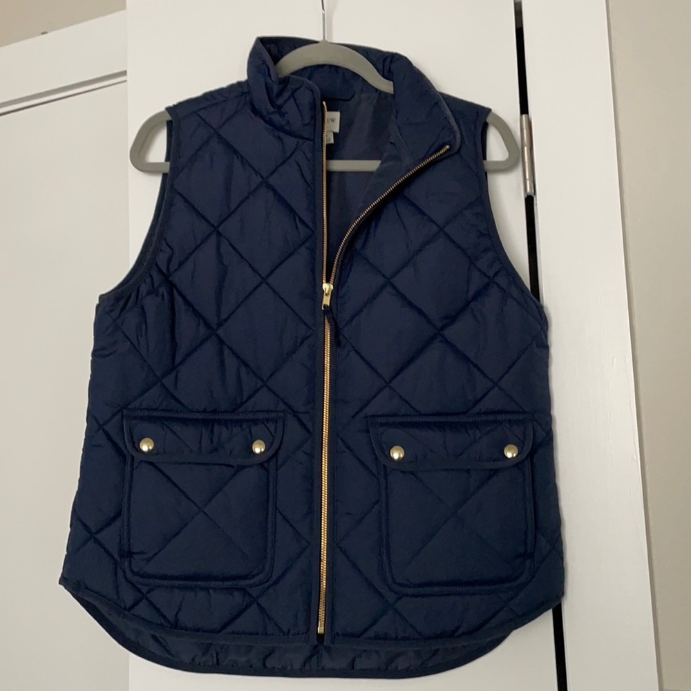 Navy quilted vest with gold zipper